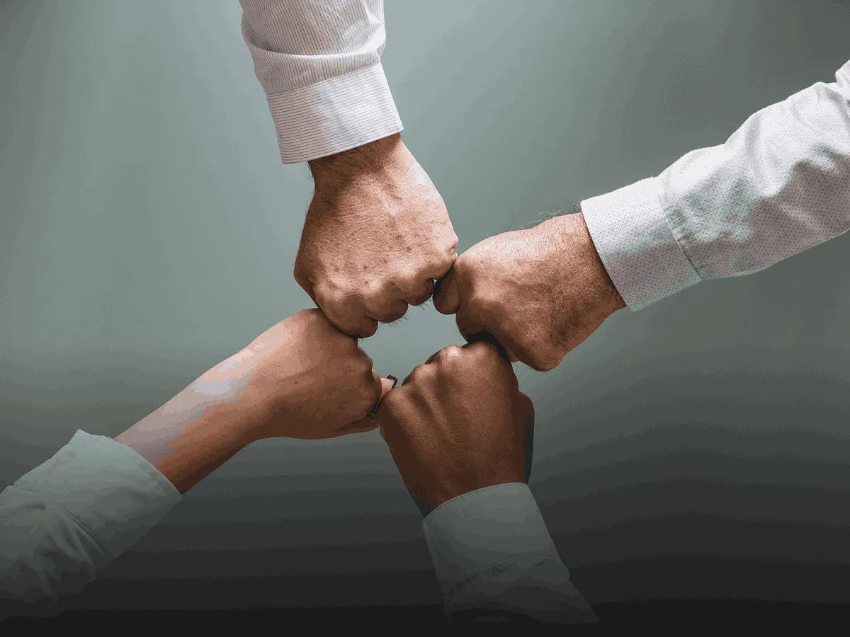 Teams hands joining - Our Mission